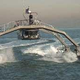 Illustration for article titled Proteus: Spider-Like Go-Fast Boat Zips Around the Bay in Dazzling Demo